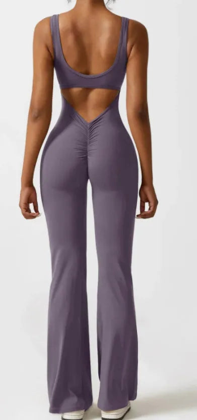 Women's black milk silk yoga bodysuit with seamless hollow design and mid-waist fit.
