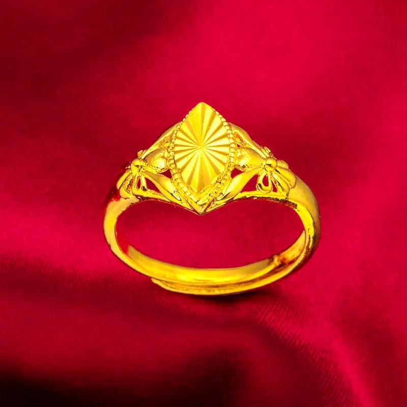 Gold electroplated brass flower ring with open geometric design and textured alluvial pattern