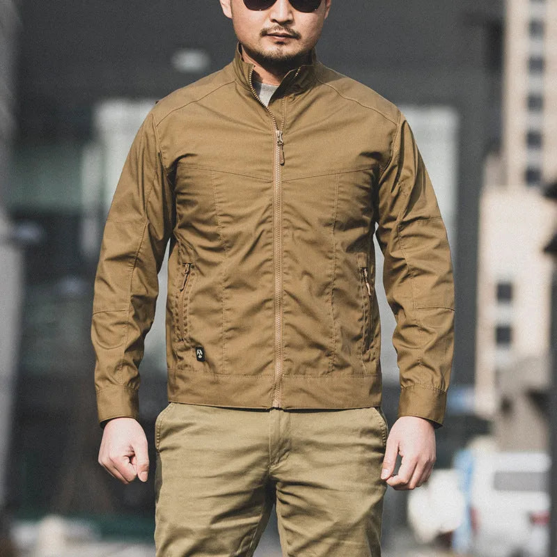 Men's brown tactical assassin jacket with camouflage pattern and multiple pockets.