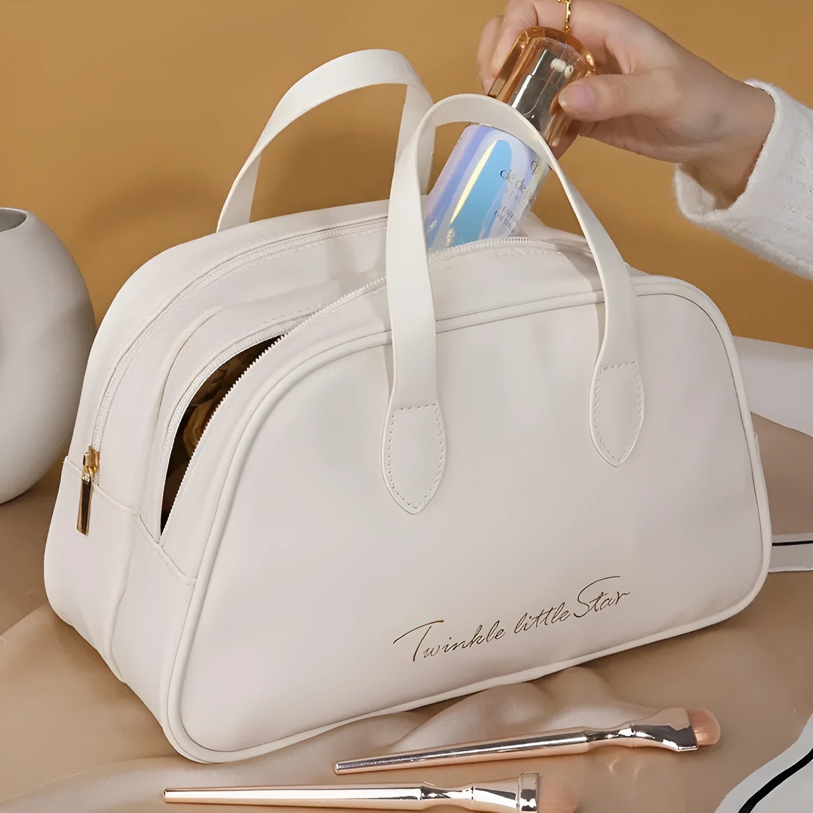 Leather travel toiletry bag in caramel mocha colour with large capacity and dry-wet separation compartments.