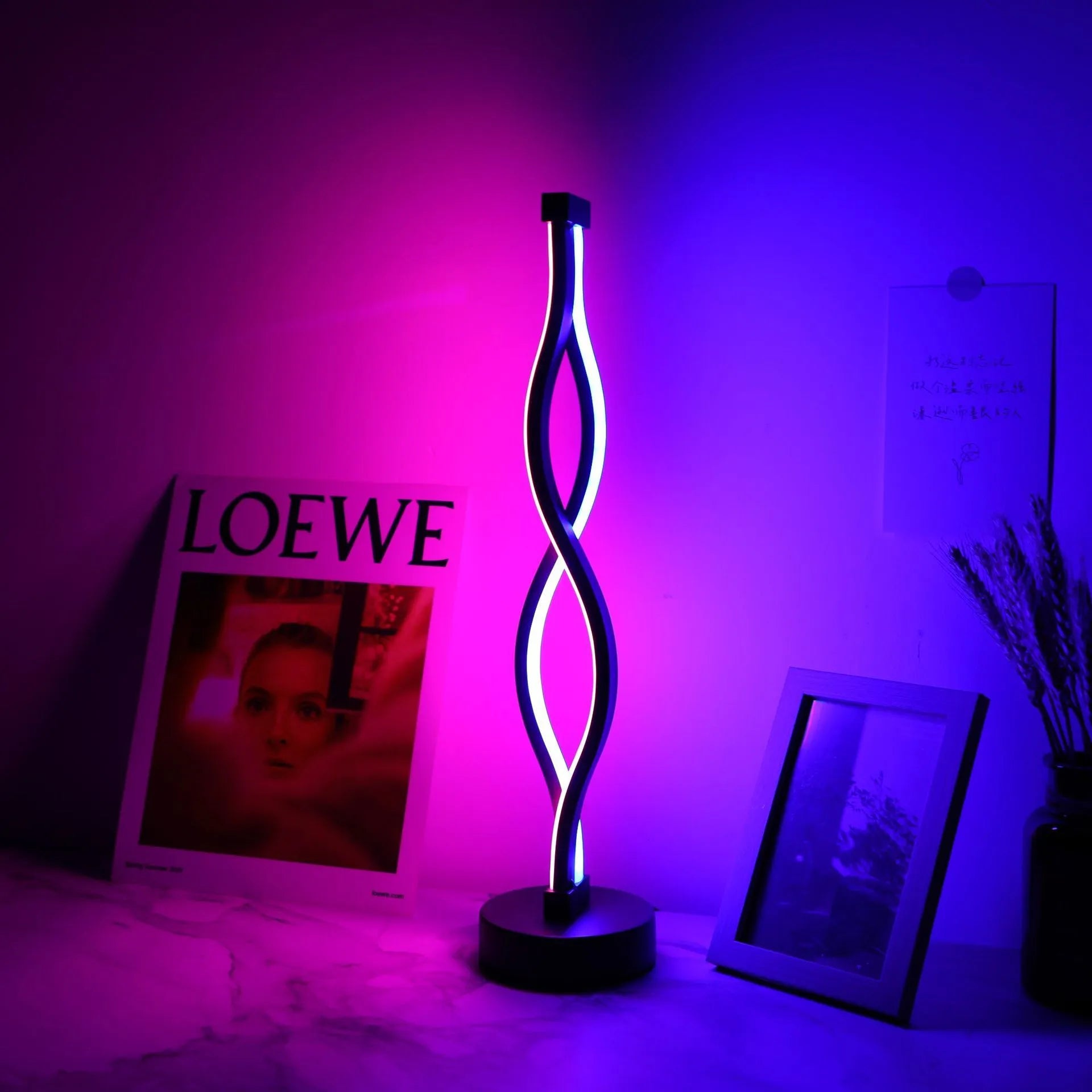 Black aluminium desk lamp with touch dimming controls and three-colour adjustment button