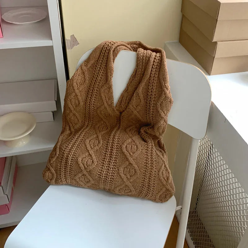 Knitted wool yarn shoulder tote bag with hollow crochet design in solid colour