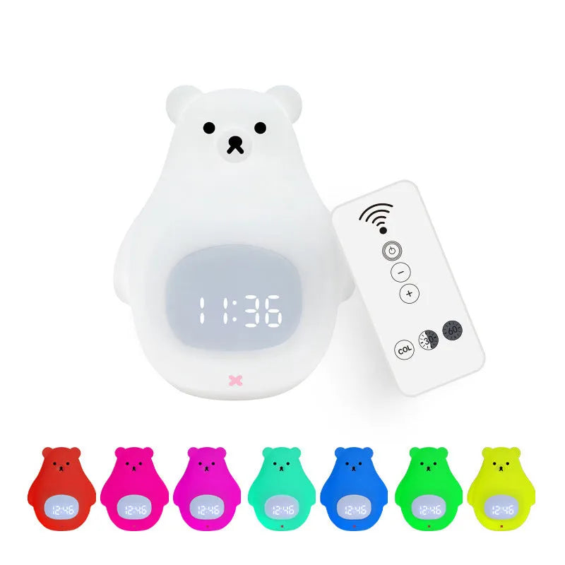 White cartoon bear silicone night light with remote control on table.
