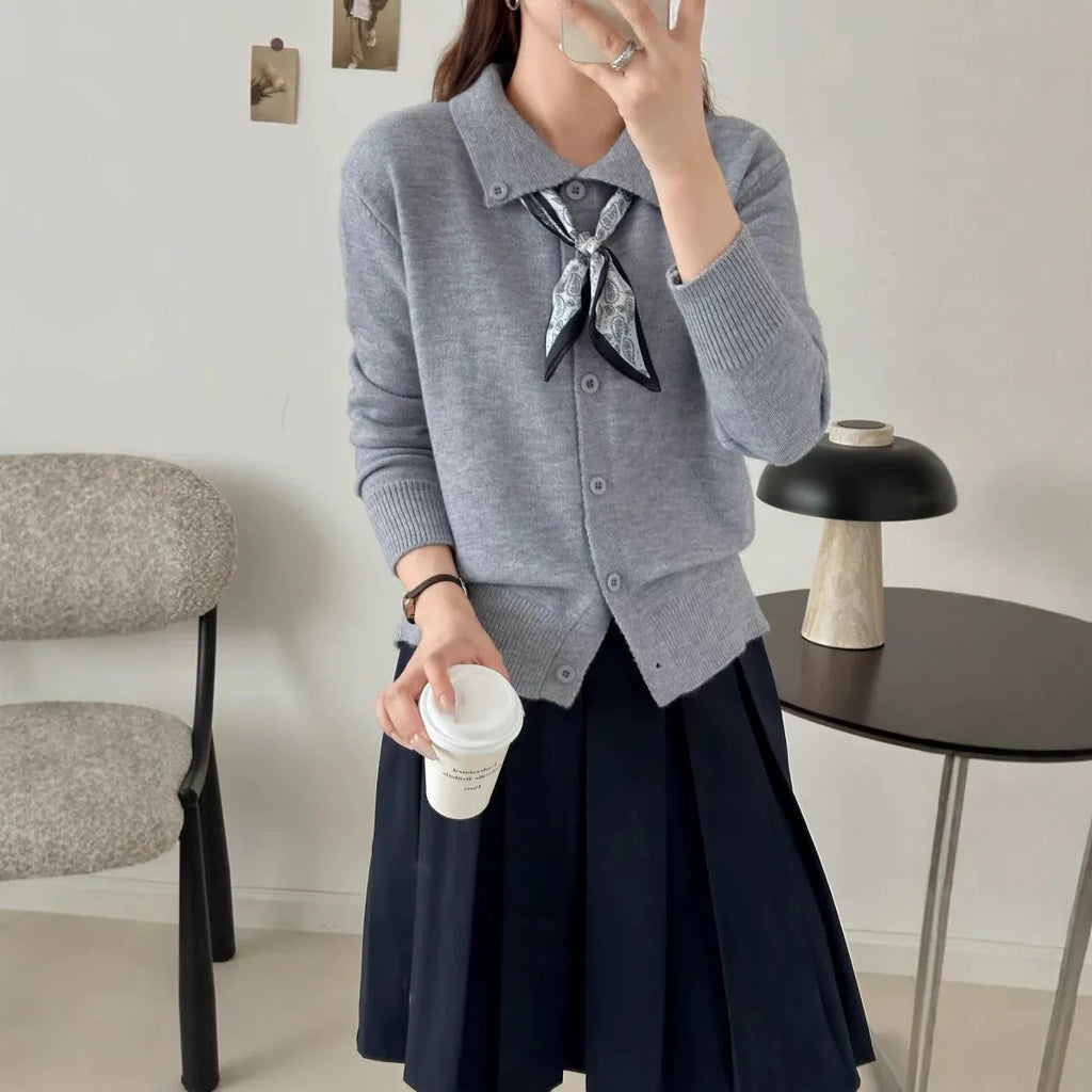Beige lapel scarf collar acrylic cardigan with long sleeves on a hanger
