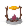 Barbecue-shaped plastic cat feeder toy for dispensing dry kibble during play.