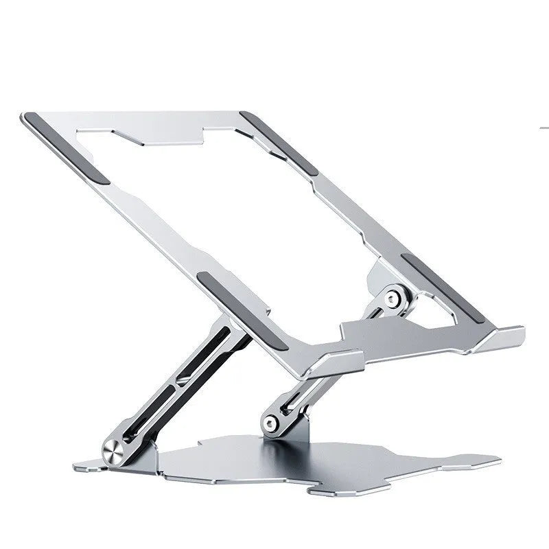 Grey aluminium folding laptop stand holding a silver laptop at an angle on a wooden desk.