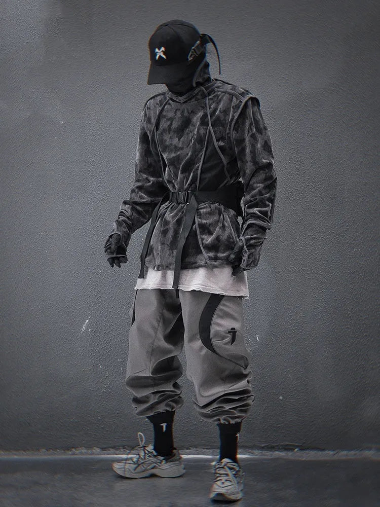 Black and grey tie dye printed men's turtleneck sweater with drop shoulders on a model.