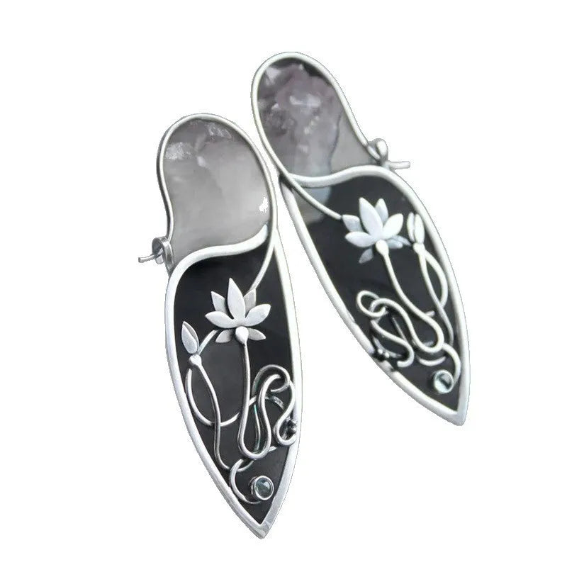 Silver lotus flower earrings with geometric shapes and rhinestone details