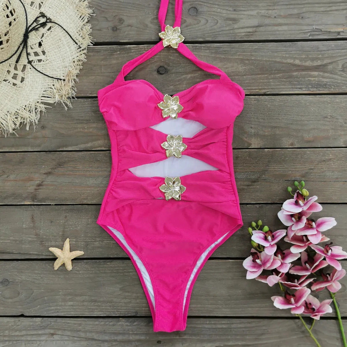 Women's solid colour one-piece swimsuit with a short skirt and hollow-out tube top design.