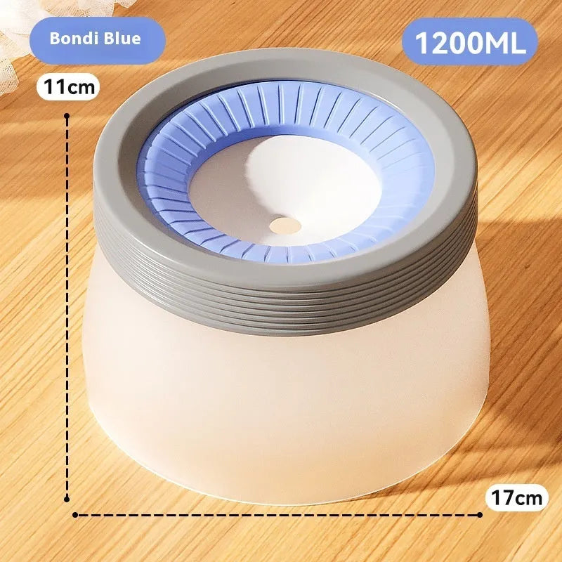 Blue suspended pet water bowl for dogs and cats on a white base plate, showing non-spill design.