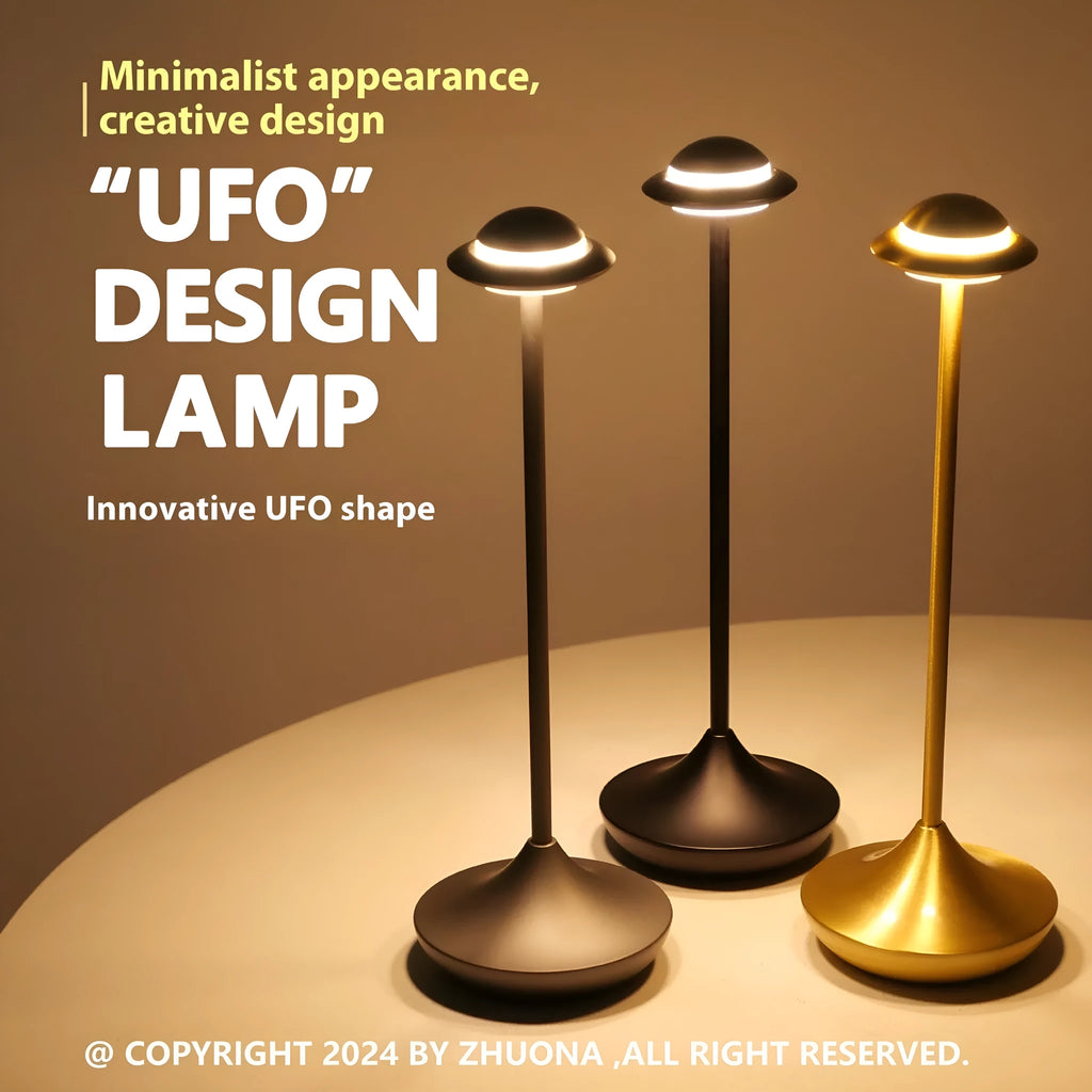 Gold UFO-shaped rechargeable table lamp with touch dimming controls on metallic surface