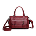 Vintage-style large messenger bag in PU leather, showing horizontal square shape and contrast stitching.