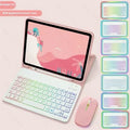 Colourful iPad leather case with attached luminous RGB backlit Bluetooth keyboard on a desk.