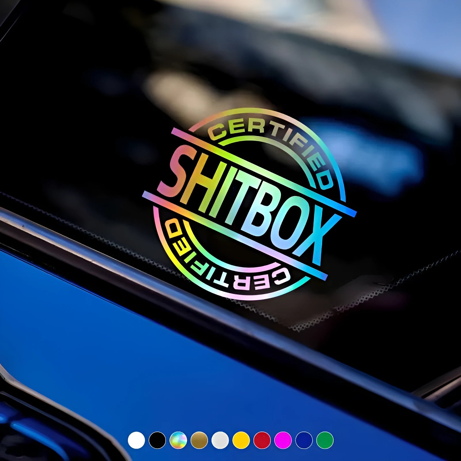 13 by 12 cm vinyl car body sticker shown in a selection of its ten available colours including black, silver, red, and glitter.