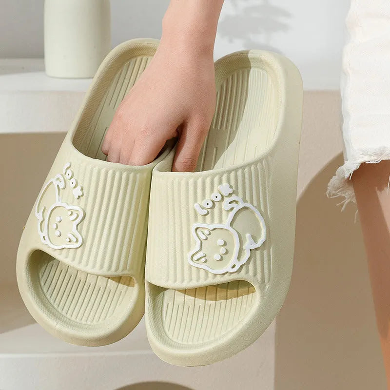 Green EVA cat flip-flop slippers with a thick platform sole on a white background.