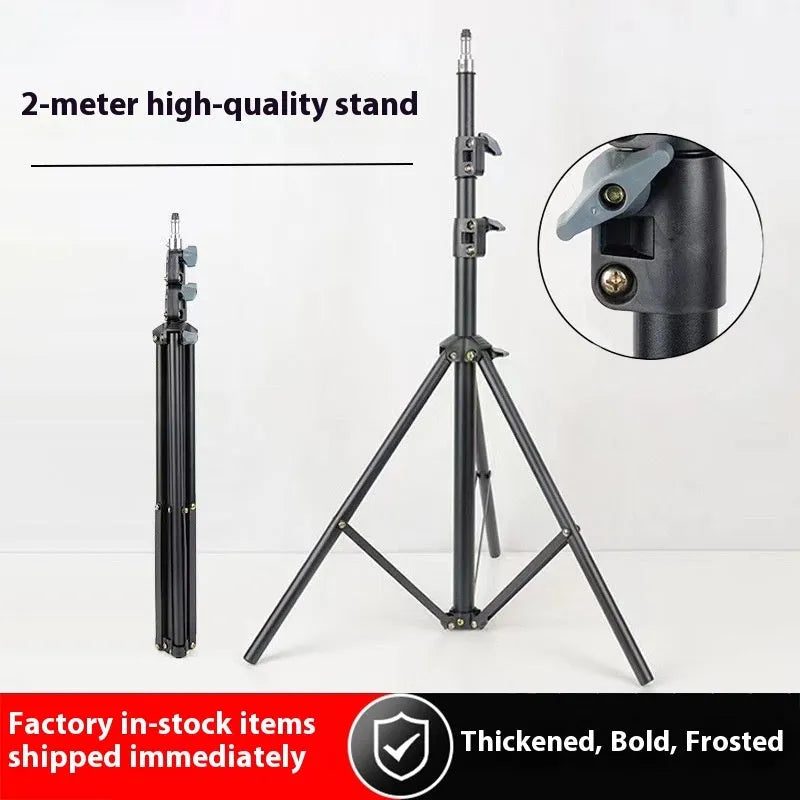 Tripod light stand with mobile phone holder showing adjustable height and frosted legs