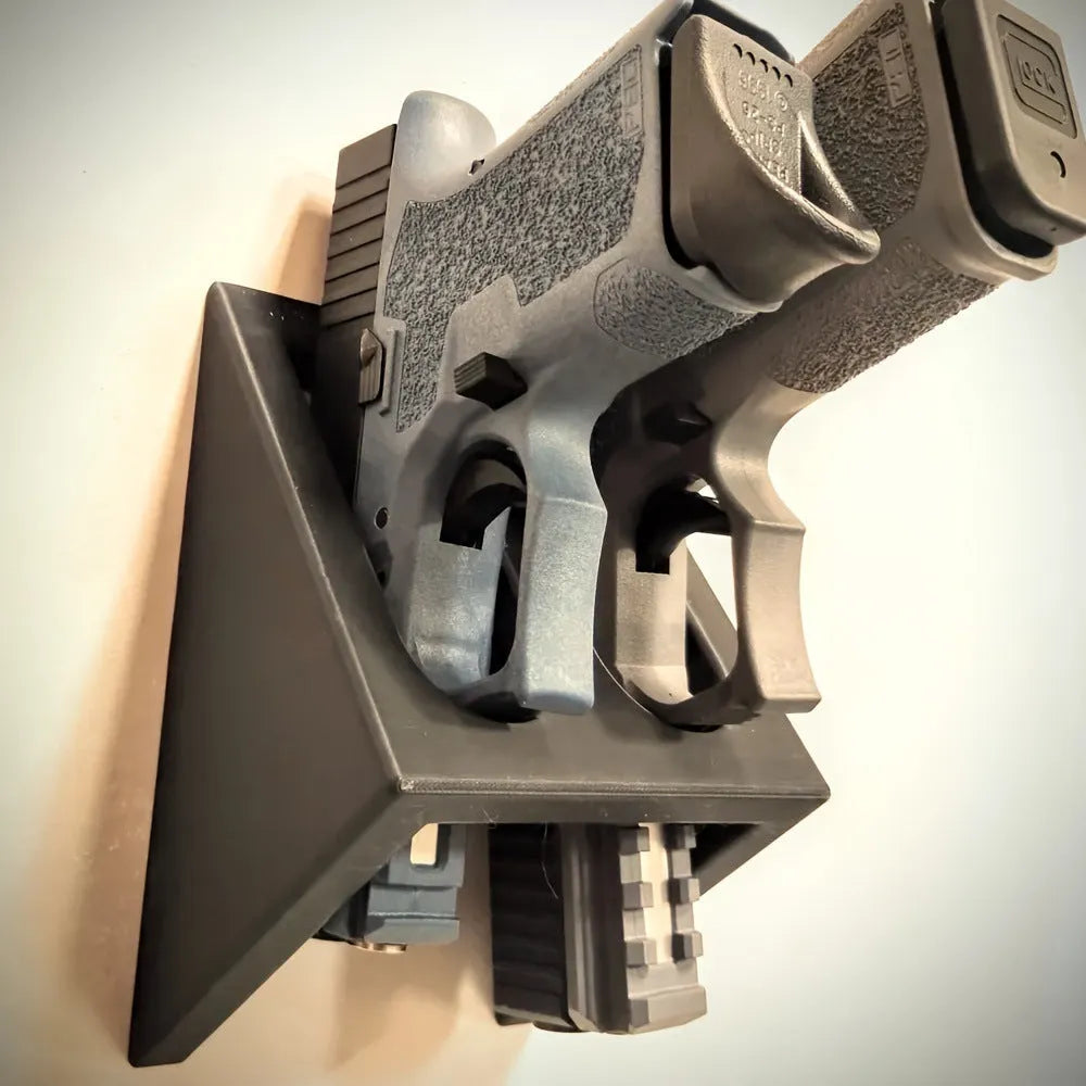 Black plastic pistol stand for 0 scale replica firearms with punk-style design