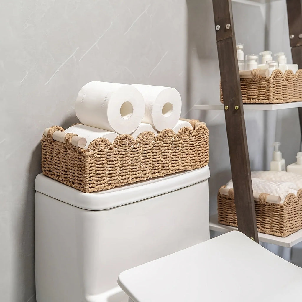 Rectangular woven paper storage basket in a choice of colours on a wooden table.