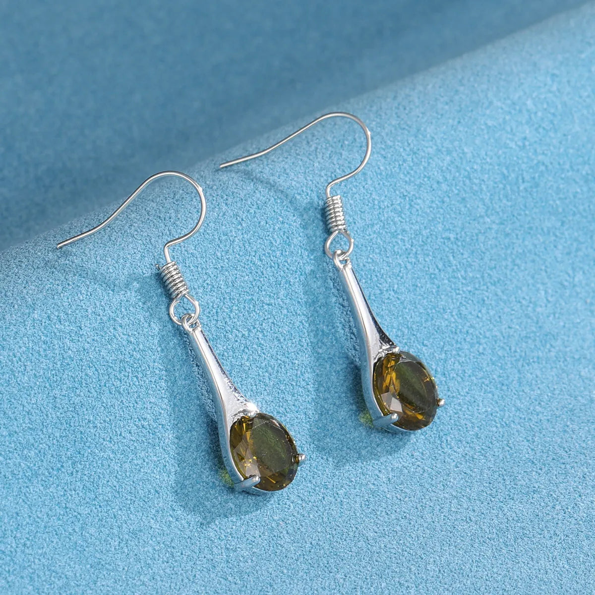 Olive green topaz earrings with water drop shape and electroplated alloy construction