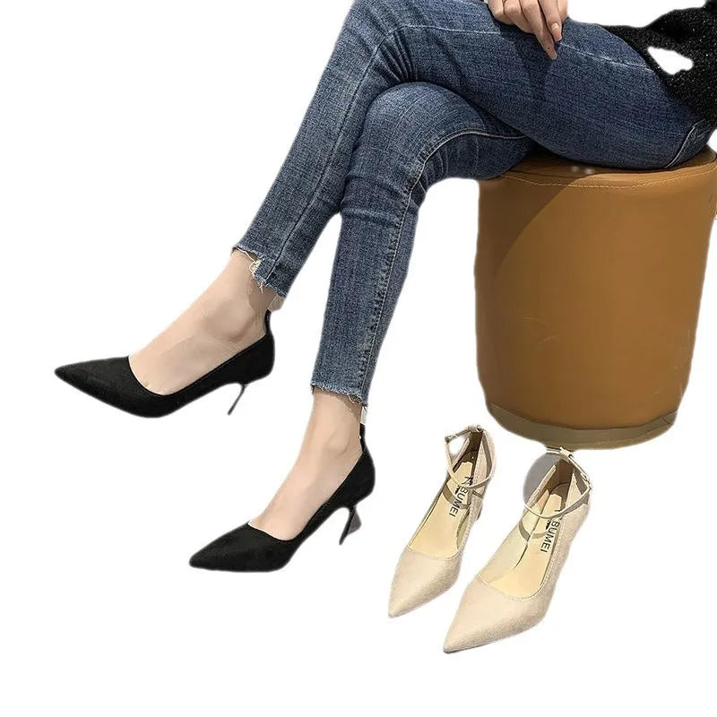 Women's black stiletto heel pump shoe with a buckle detail on the upper