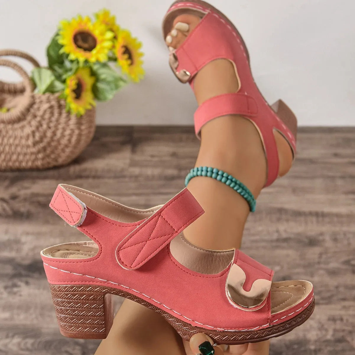 Women's light brown flat Roman sandals with a Velcro strap fastening and round toe.