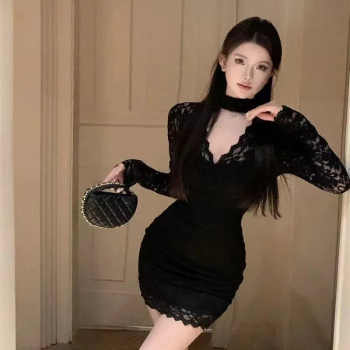 Black halter neck lace dress with high waist, A-line skirt, and hip-wrap detail on a mannequin.
