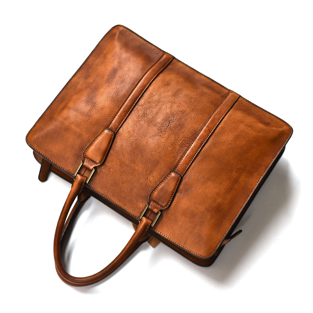 Men's brown leather retro horizontal business handbag with zipper opening.