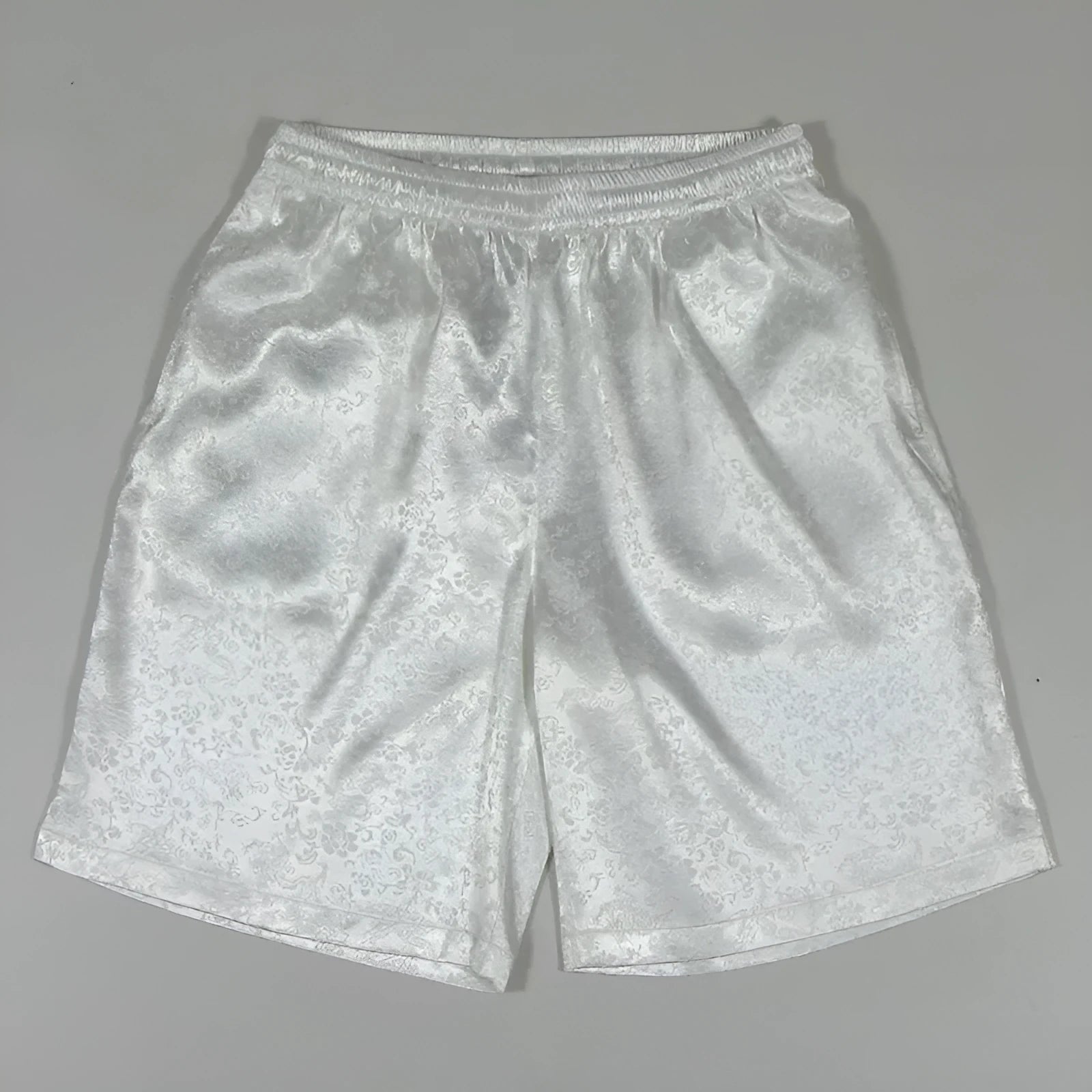 Men's black Tang suit style shorts with a loose fit and elasticated drawstring waistband.