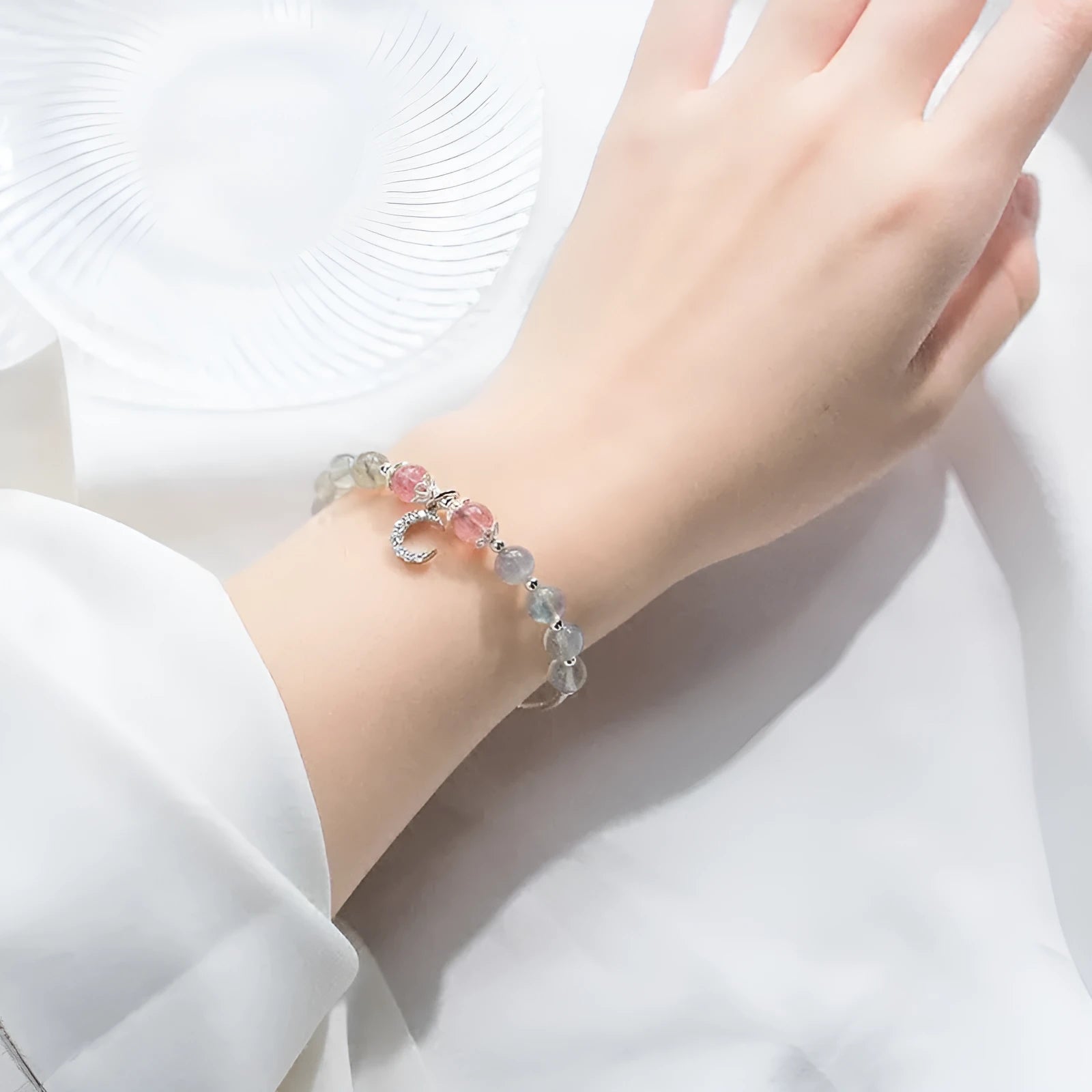 Natural moonstone adjustable bracelet with crescent moon charm showing 6mm bead and silver extension chain