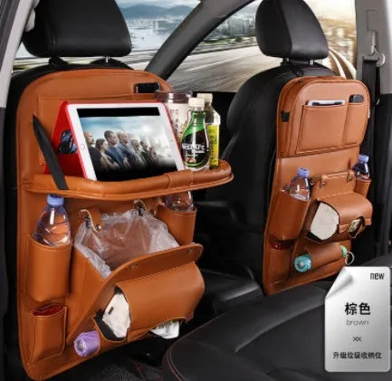 PU leather car storage hanging bag with multiple pockets and built-in trash can mounted on car seat