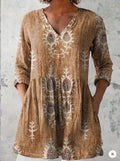 Women's printed loose wave dress with wide waist and three-quarter sleeves in a floral pattern.