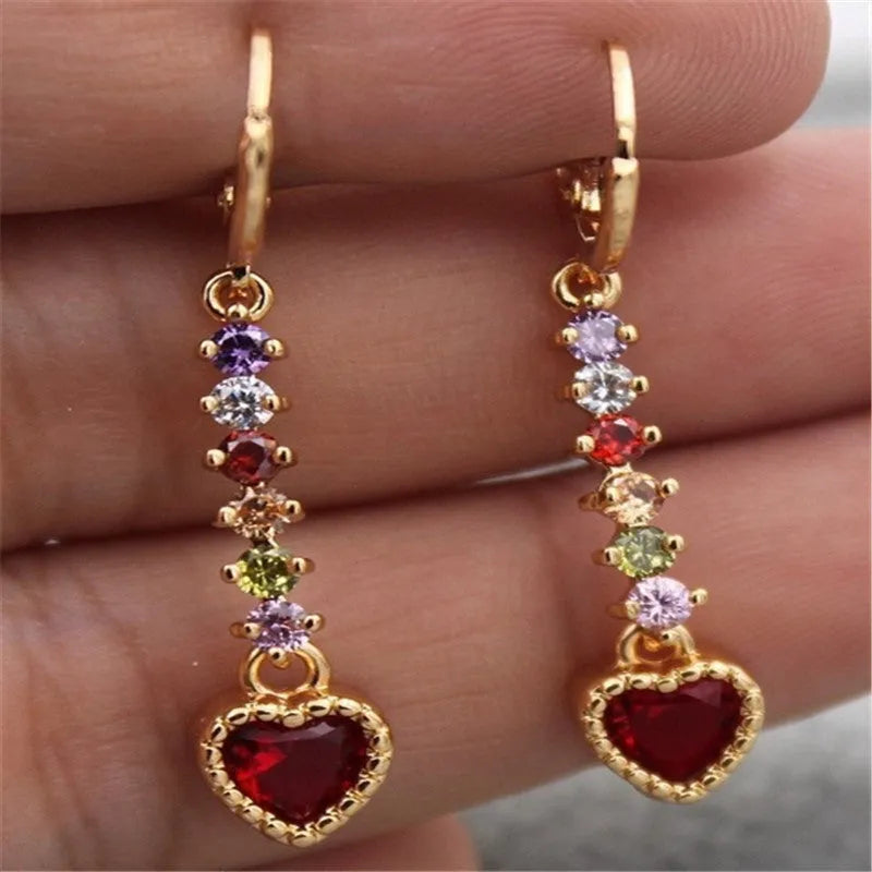 A pair of women's heart-shaped alloy earrings with an electroplated gold or silver finish.