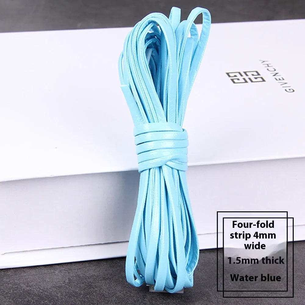 Coils of PU leather craft cord in multiple colours including black, red, blue, and beige