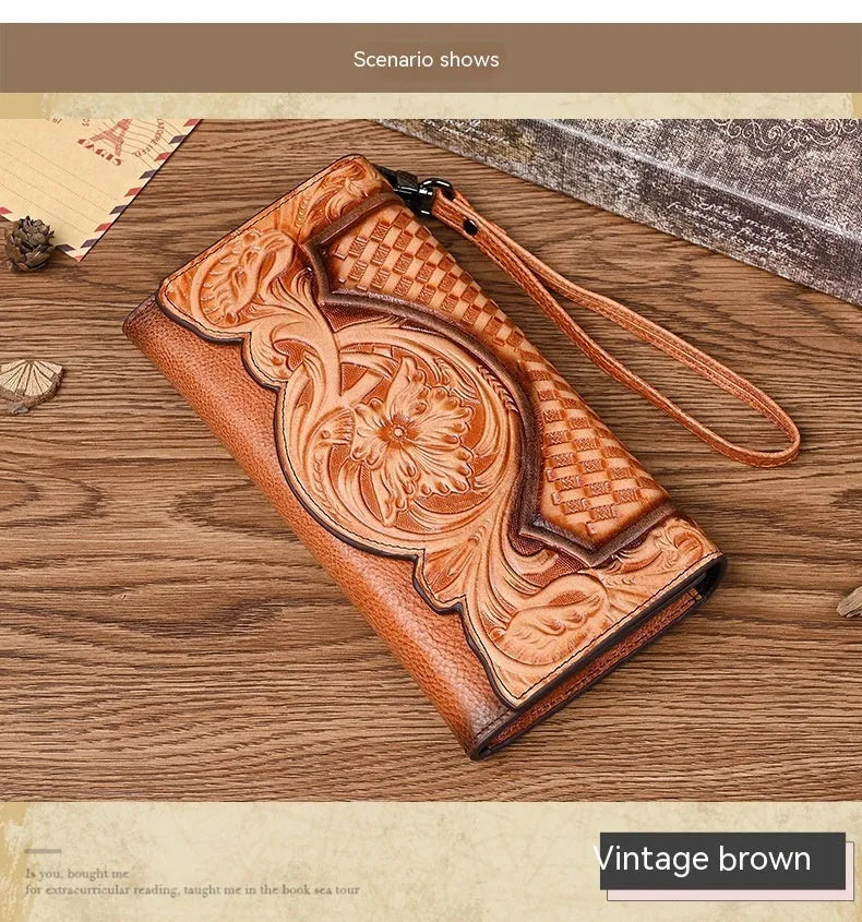Retro brown floral embossed tri-fold leather wallet open to show interior compartments.