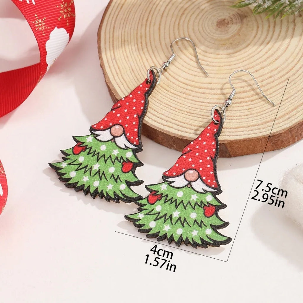 Wooden Christmas earrings with printed tree and snowman designs in geometric shapes