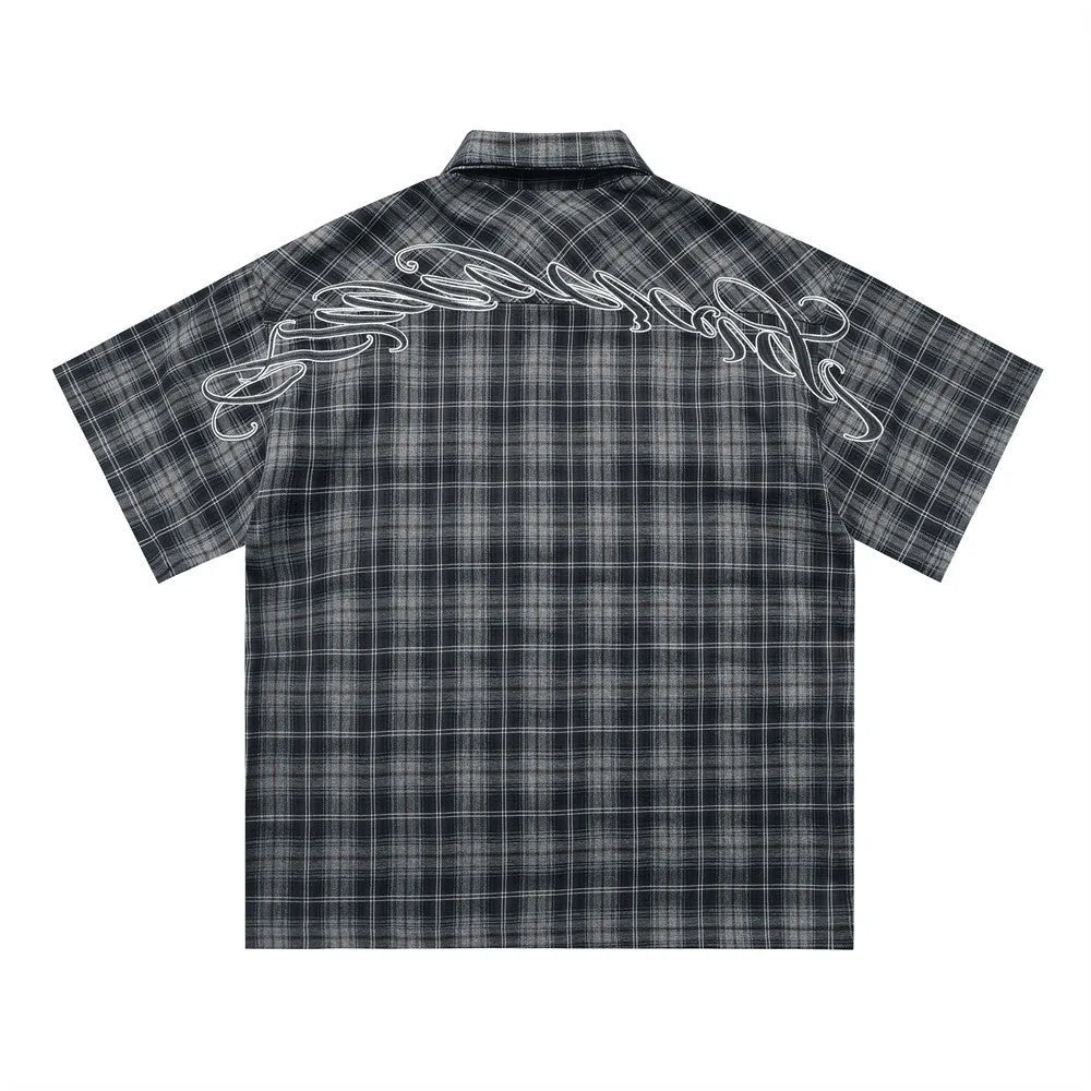 Men's black and brown plaid short sleeve shirt with embroidered lapel detail
