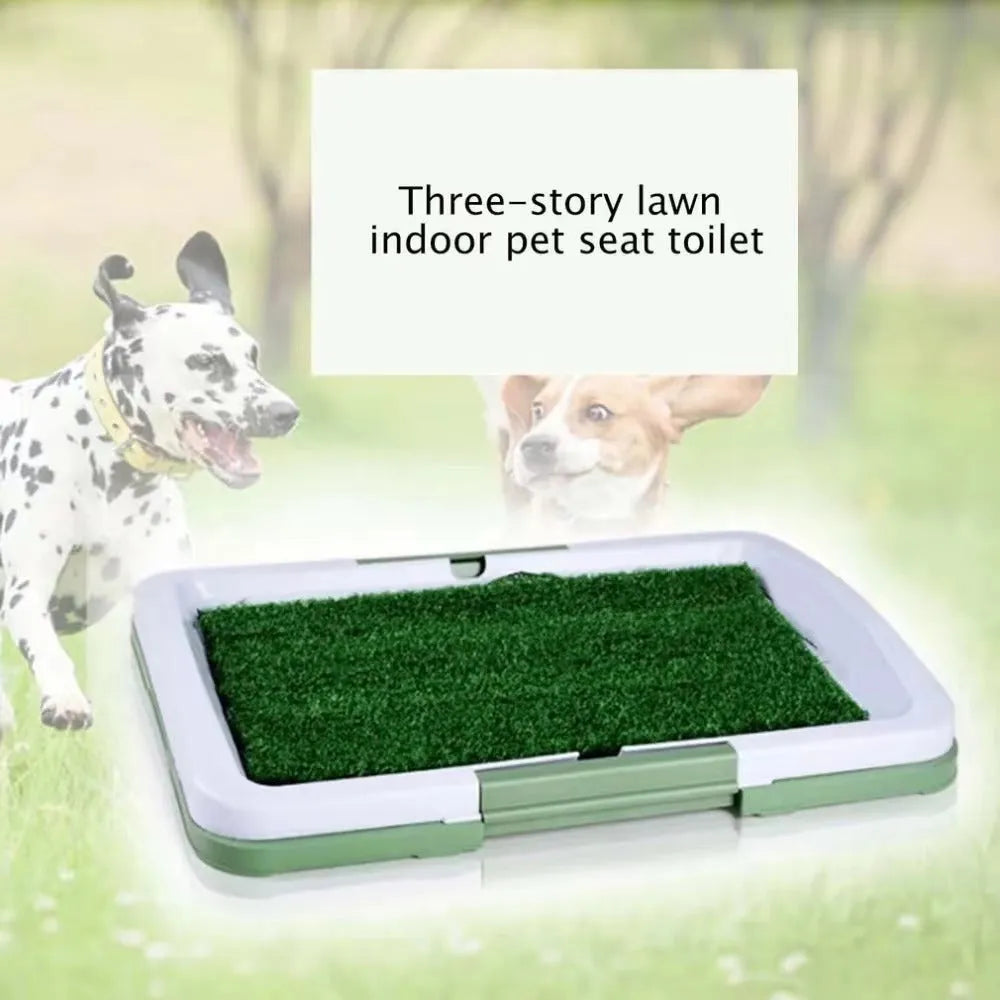 Green synthetic turf dog toilet trainer with three-layer plastic tray system for indoor use.