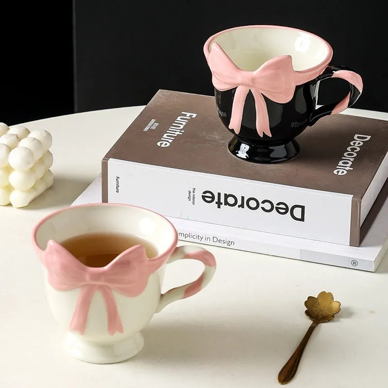 Ceramic mug with bow and heart design in white powder or black pink colours