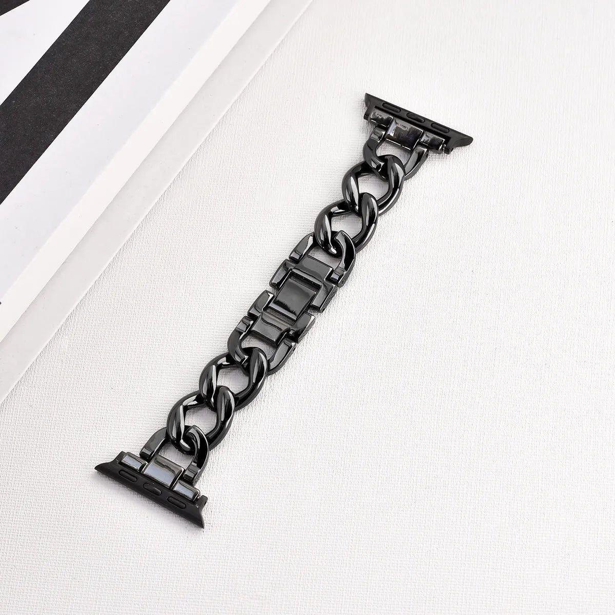 Metal denim chain replacement strap for Apple Watch in silver, black, gold, rose gold, and Starlight colours.