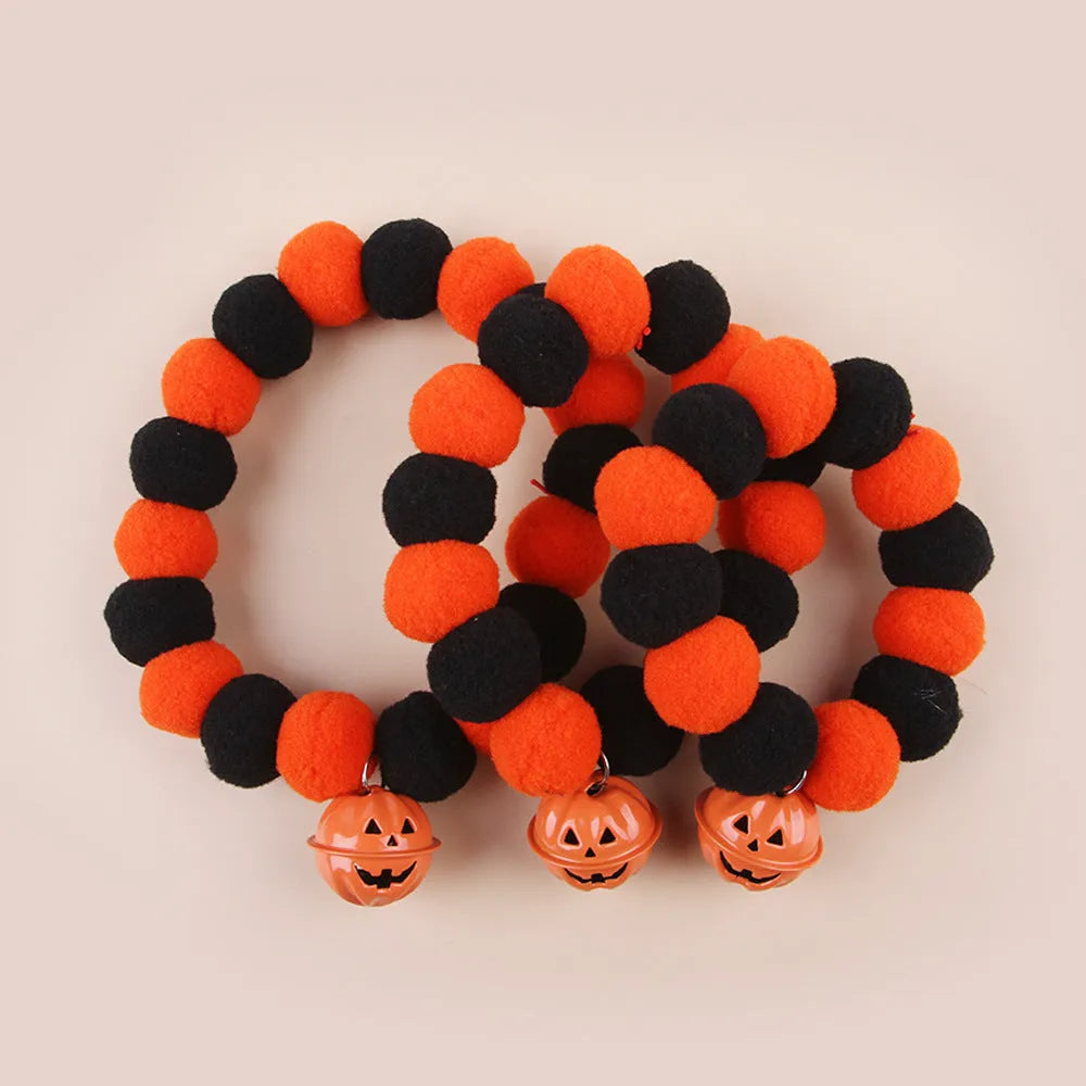 Orange Halloween pumpkin motif cat collar with an adjustable buckle fastener.