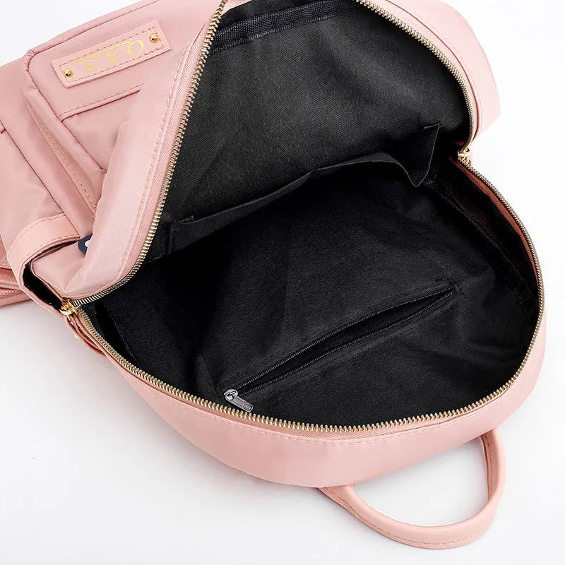 Women's black waterproof casual backpack with double shoulder straps and internal organisation compartments