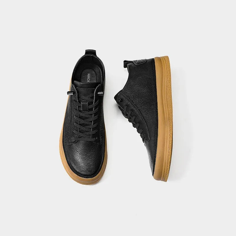 Men's black leather casual lace-up shoes with a round toe and flat rubber sole on a white background.