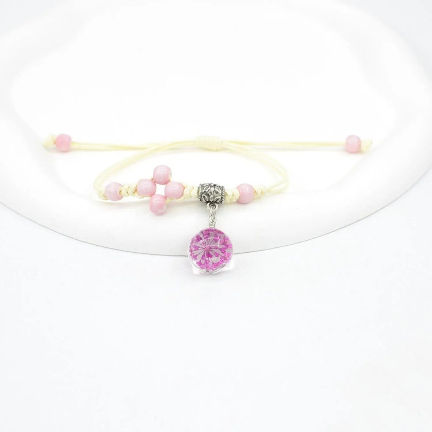 Glass dried flower bracelet with large 1.4 cm beads containing real preserved flowers in hand-woven lace design