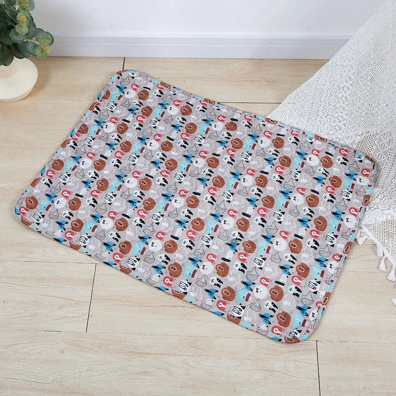 Reusable washable pet urine pad with animal print design and waterproof layer.