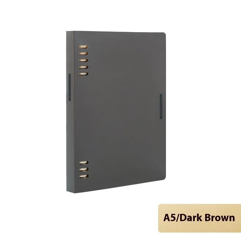 Refillable loose-leaf spiral notebook with PP cover open, showing raw wood pulp paper in grid ruling.