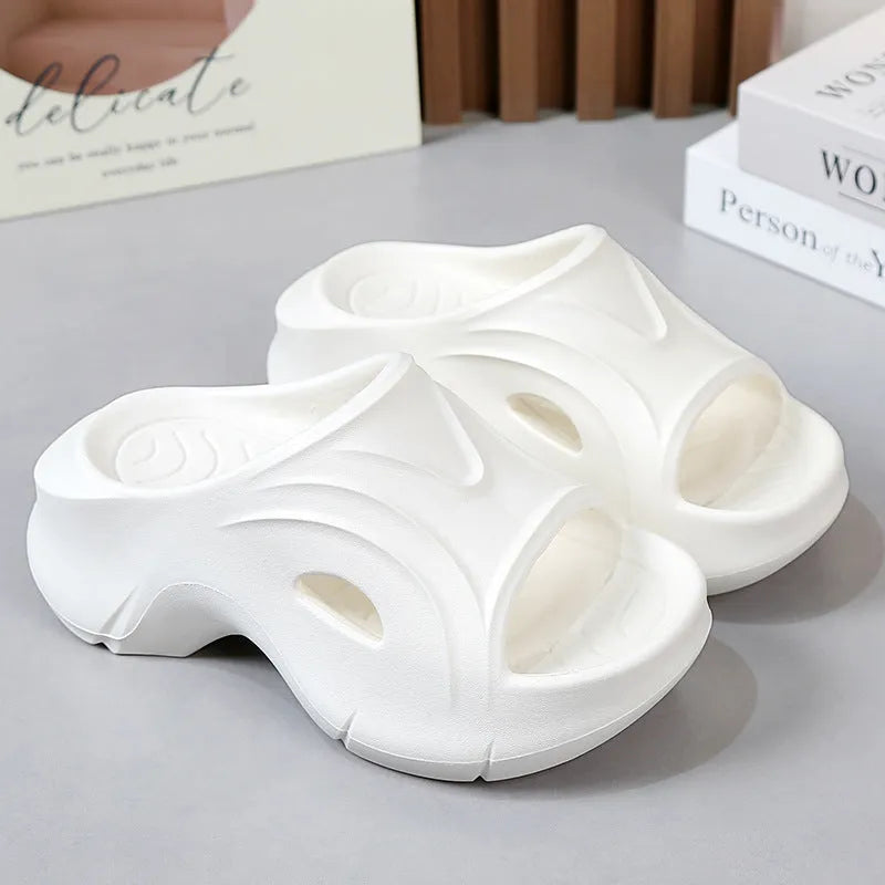 Women's thick-soled beach slippers in white, black, and rose red colours with EVA construction