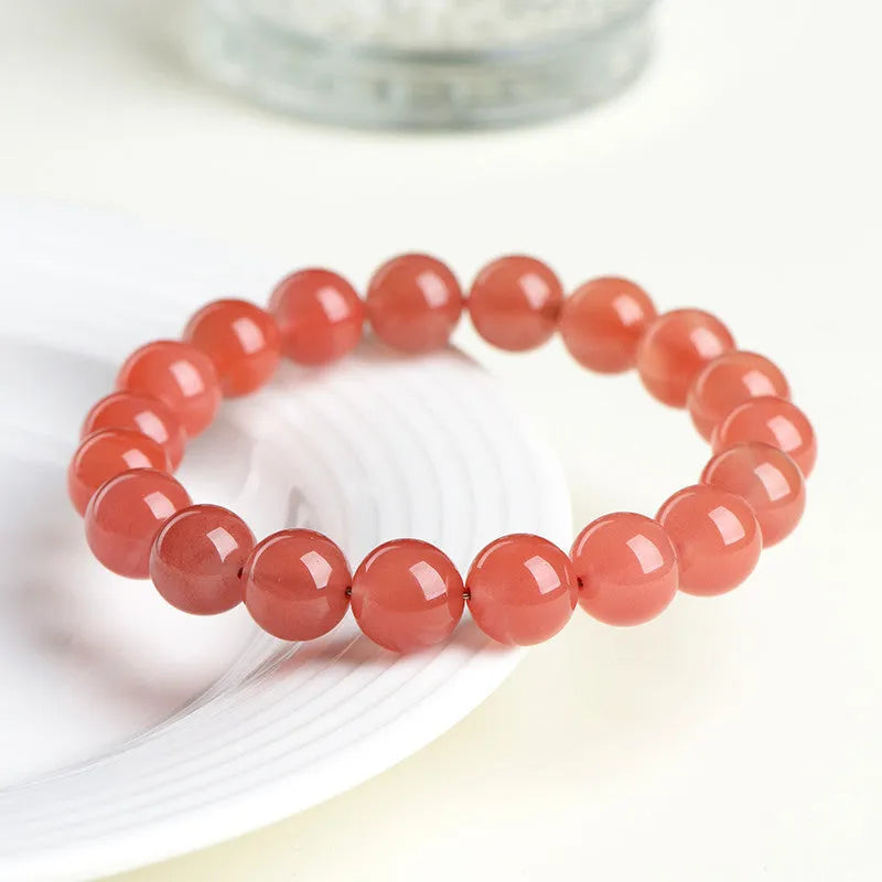 Natural polished cherry red agate scattered beads bracelet on a wrist, showing single circle and three circle size options.