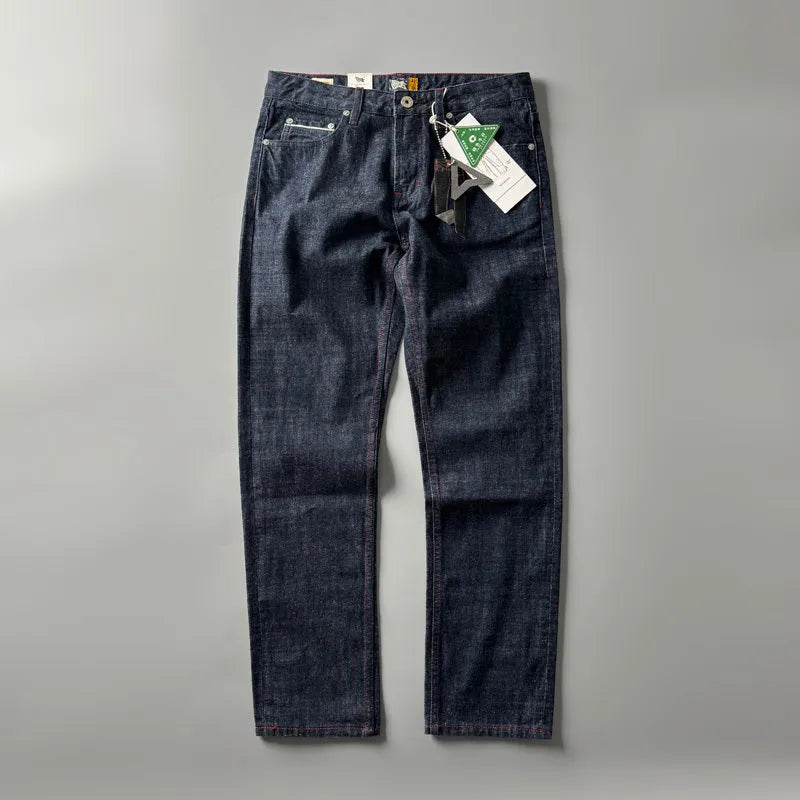 Men's straight-leg cotton denim trousers in a primary colour wash, showing mid-waist fit.