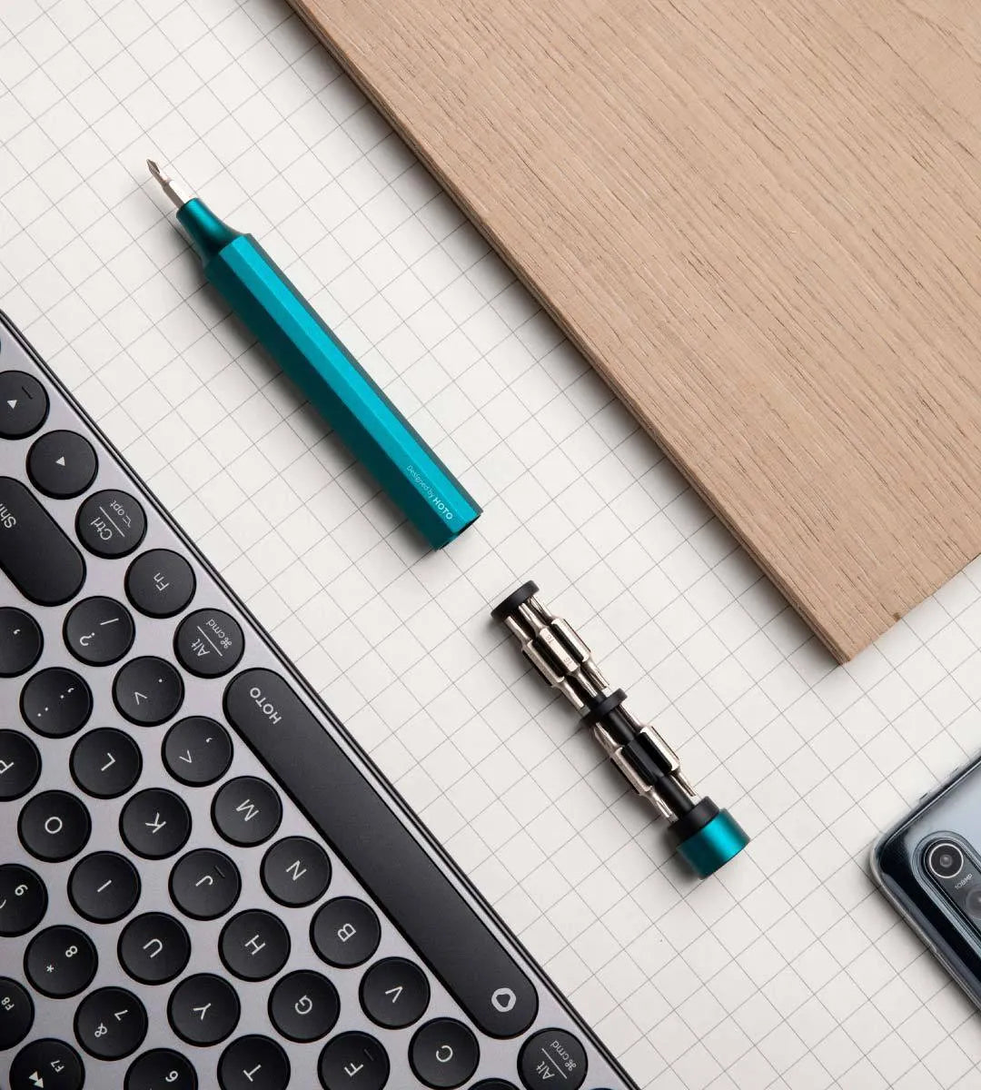 Green 24-in-1 aluminium repair screwdriver set with bits stored magnetically inside the handle.