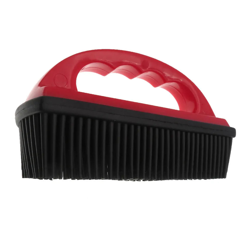 Red pet hair removal and massage brush for grooming and carpet cleaning.